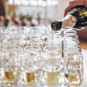 waiter-pouring-champagne-in-stylish-glasses-at-lux-2022-02-02-03-59-28-utc