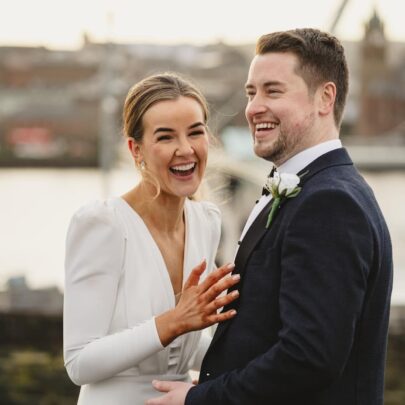 bride ad grrom laughing peace bridge